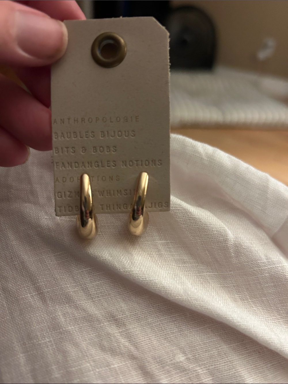 Anthropologie chunky gold hoop earrings.
